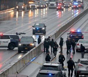Interstate 5 closed in both directions Monday morning in North Portland as more than two dozen police units converged on the highway.