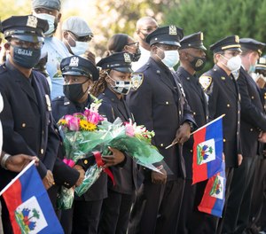 NYPD officers lined the street outside Lt. Yvan Pierre Louis' home when he returned after a five-month hospitalization with COVID-19.