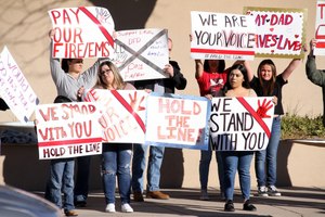Demonstrators voiced their support for the 14 Deming firefighters who gave notice over the issue of their pay.