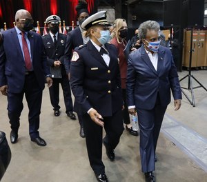 Mayor Lori Lightfoot, right, with Acting Fire Commissioner Annette Nance-Holt following a graduation for firefighter and paramedic candidates at Robert Quinn Fire Academy last May.