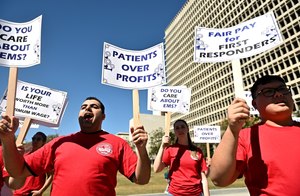Employees of Care Ambulance protested for higher wages outside L.A. City Hall on Monday.