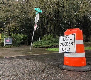 A traffic barrel blocks the road at Southeast Knight Street and 72nd Avenue next to Mount Scott Park on Tuesday, March 1, 2022.