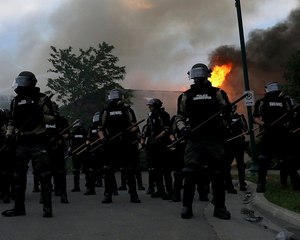 Law enforcement officers were on scene to protect firefighters at Migizi, a Native American nonprofit in south Minneapolis, near the Minneapolis police Third Precinct on May 29, 2020.