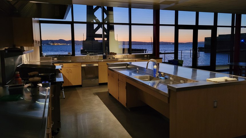 An interior view of the floating station's spacious kitchen overlooking the water. 