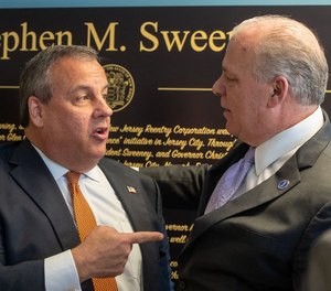 Former Gov. Chris Christie (left) speaks to then-state Senate President Stephen Sweeney in Kearny in 2021.
