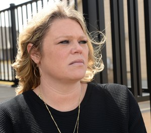 Katie Slifko at home in Farmington, Sunday, April 10, 2022. Her husband Cory Slifko, a South St. Paul police officer, died by suicide in 2019 after being diagnosed by multiple doctors with post-traumatic stress disorder stemming from his work.