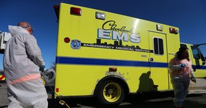 Josh Wojciechowski, of Emergency Clean Team, sanitizes an ambulance at Beverage Distributors, Inc. Beverage Distributors, Inc. offered to sanitize the vehicles of first responders.