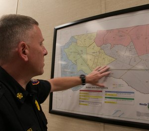 Winslow Township Fire Chief Marc Rigberg shows a map of the 60 square miles the department covers at Cedar Brook Volunteer Fire Company in Sicklerville. After 97 years, the fire station halted emergency operations in mid-April due to low staff numbers.