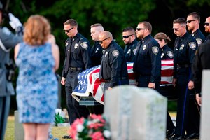Officer Drew Barr's colleagues at the Cayce Police Department carried his casket during a funeral service Thursday at Mt. Ebal Baptist Church Cemetary in Batesburg-Leesville.