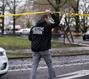 A Portland Police Bureau homicide detective investigates a fatal shooting on March 1, 2022.