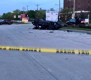 Three armed suspects carjacked an unmarked police car from a Baltimore police detective outside a convenience store Tuesday evening, then sped away before crashing.