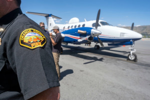A Fire Integrated Real-time Intelligence System airplane was on display on the tarmac at Burbank Airport Tuesday. The state Office of Emergency Services, the L.A. city fire department and the Orange County Fire Authority held a media availability to demonstrate the airplane, which is equipped with high-def and infrared cameras. The plane can be sent anywhere in California and can send real-time images, information, and projections to first responders and emergency managers on the ground.