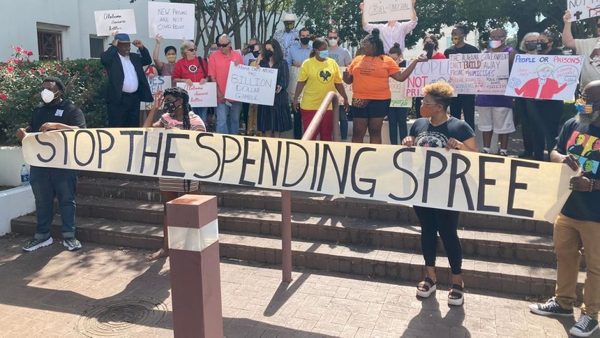 Protesters at the Alabama State House speak out against a plan to build two 4,000-bed prisons and the use of federal coronavirus funds to help pay for them.