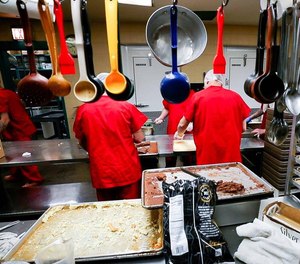 Inmates prepare meals in the kitchen at the Madison County Detention Center in Richmond, Kentucky.