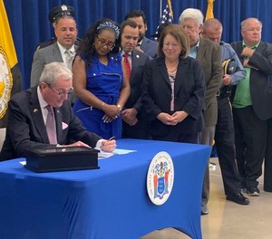 Gov. Phil Murphy signs legislation creating a police licensing system in New Jersey on July 21, 2022.