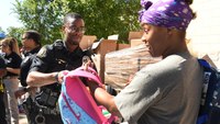 Black officers' association gives out free backpacks, back-to-school haircuts