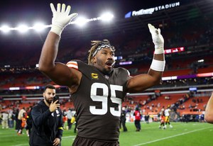 Cleveland Browns defensive end Myles Garrett celebrates as he leaves the field after defeating the Pittsburgh Steelers. He intends to get back to playing soon after crashing his car.
