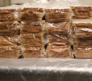 Bologna sandwiches piled on a table in the kitchen, ready for distribution at the Cuyahoga (Ohio) County jail on June 2, 2022. Cleveland.com took a tour of the facility to observe conditions in the 46-year-old building as the county weighs building a new one. (Photo David Petkiewicz/cleveland.com via MCT)