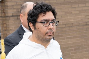 Peter Zisopoulos is pictured outside the NYPD 114th Precinct stationhouse on Astoria Blvd. in Queens on Sept. 30.