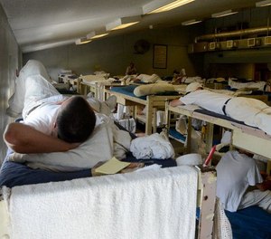 Inmates resting in a dorm in Staton Correctional Facility in Elmore County in September 2013. Staton is one of the prisons slated to close when Alabama completes construction of two new 4,000-bed prisons. But a year after lawmakers approved the new prisons, the state has not yet lined up a builder for one.