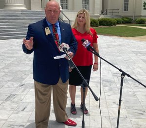 Stacy Lee George, a former correctional officer at Limestone Correctional Facility, and his wife.