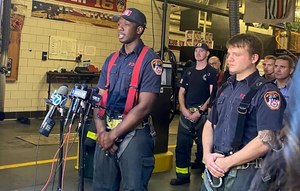 FDNY Firefighters Belvon Koranteng, 26 (left), and Arthur Podgorski, 28 (right), spoke at the Engine 39/Ladder 16 station house in Manhattan. They participated in the rescue.