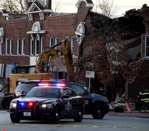 Three people were killed when a fire truck collided with an SUV and struck a building on Dec. 15, 2021.