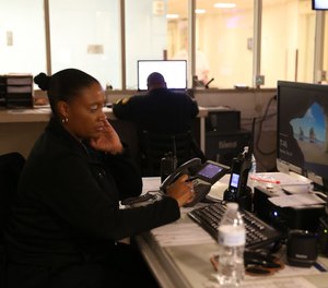 Cuyahoga County corrections officers monitor cellblocks from the control room at the jail during a June 2022 tour.