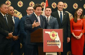 Florida Governor Ron DeSantis speaks to the applause of firefighters as he accepts the endorsement of the Florida Professional Firefighters during a gathering at the Hilton Orlando on July 12, 2022.