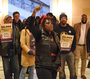 Naomi Gaines-Young of Columbia Heights speaks to a group in support of a bill to restore voting rights to felons who've completed their incarceration but are still on probation or parole.