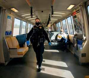 BART police officer Mindy Hernadez wears a mask while patrolling the Berryessa to Daly City train, Friday, July 15, 2022.