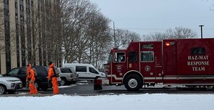 Haz-mat team members decontaminated the apartment building’s elevators, and a contaminated crime scene team cleaned the apartment where crewmembers found two men dead and another person critically ill.