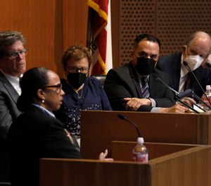 From left to right are Sgt. Jefferson Chow, and LA County commissioners Sean Kennedy, Patti Giggans, Luis Garcia and Robert Bonner.