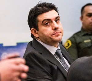 Hossein Nayeri listens to opening statements in superior court in Santa Ana, CA. Nayeri is accused of kidnapping and vehicle theft following his escape from an Orange County jail in 2016.