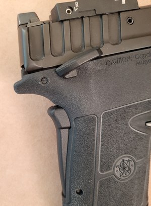 The Equalizer's excellent grip and thumb safeties. Both are great designs that add layers of Murphy insurance.