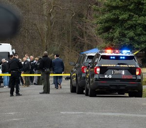 Investigators work at a scene on Doman Avenue in Deptford, NJ on Friday, March 10, 2023.