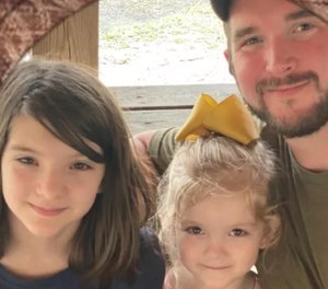 Bibb County Deputy Brad Johnson was killed in the line of duty in June 2022, leaving behind two daughters - Lana and Livy.