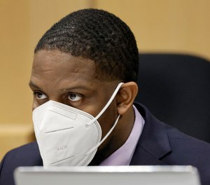 Darran Johnson is seen at the defense table during his trial at the Broward County Courthouse.