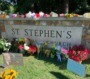 Flowers decorate the sign in front of St. Stephen's Episcopal Church in Vestavia Hills on June 19, 2022, as the congregation returned to worship services after three of its members were shot and killed at a church dinner in the parish hall on June 16.