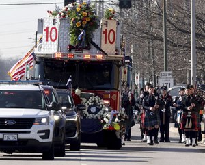 The funeral procession moved down Cumberland Avenue toward St. Joseph Ukrainian Catholic Church.