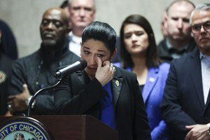 Illinois Comptroller Susana Mendoza wipes a tear while speaking on behalf of her brother, police Sgt. Joaquin Mendoza, during a news conference at Chicago's City Hall on Feb. 21.