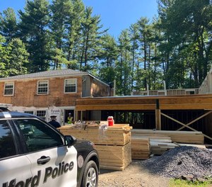A wall fell on several workers in Bedford, Mass.