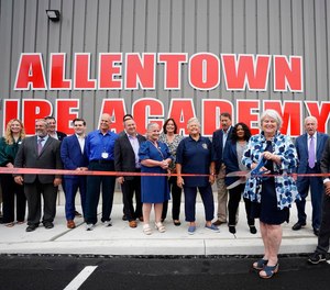 Andrea Kiskeravage cuts the ribbon officially opening the center named in honor of her late husband, Chris.