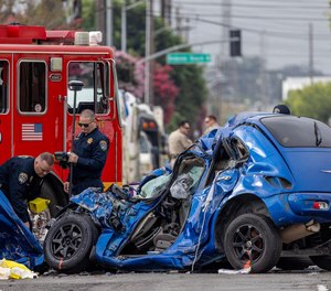Multi-disciplinary Accident Investigation Team at the scene of a double fatal crash involving a Los Angeles County fire truck and sedan