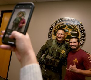 Orange County Sheriff's Deputy Jesse Carrasco, who responded to the Cook's Corner shooting in August, formally met for the first time with off-duty security guard Nelson Rosales who was inside the bar at the time of the shooting. Rosales ran out of the bar to warn deputies about the shooter's location, preventing them from walking into the gunman.