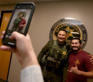 Orange County Sheriff's Deputy Jesse Carrasco, who responded to the Cook's Corner shooting in August, formally met for the first time with off-duty security guard Nelson Rosales who was inside the bar at the time of the shooting. Rosales ran out of the bar to warn deputies about the shooter's location, preventing them from walking into the gunman.