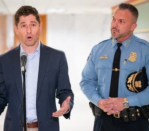 Minneapolis Mayor Jacob Frey, left, and Minneapolis Police Chief Brian O Hara announced an agreement over funding police retention and recruitment incentives Friday at City Hall.