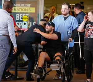 Hillsborough County sheriff's Deputy Manuel “Manny” Santos is greeted by fellow deputies after being released from Tampa General Hospital on Saturday.