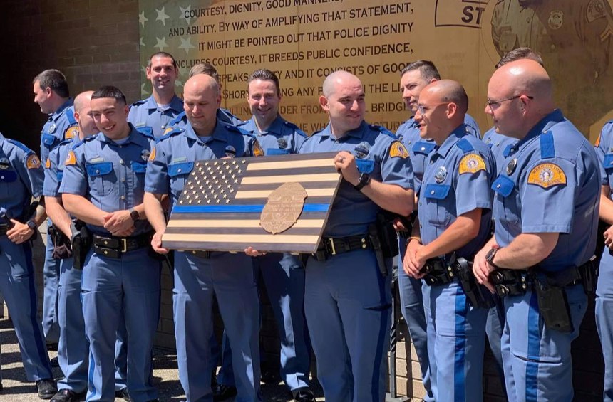 Washington State Patrol's 114th basic academy class receives a memorial flag to remember Trooper S. Renee Padgett. On September 4, 2018, Trooper Padgett lost her battle with a rare blood cancer.