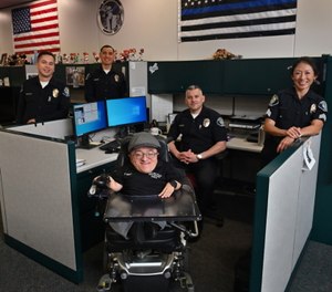 Santa Ana Police Investigator Ryan Berger, center, with some of the Santa Ana Police Department detectives he works with, from left, David Prewett, Mario Lopez, Ernesto Solorio and Det. Sgt. Sandy Kim.